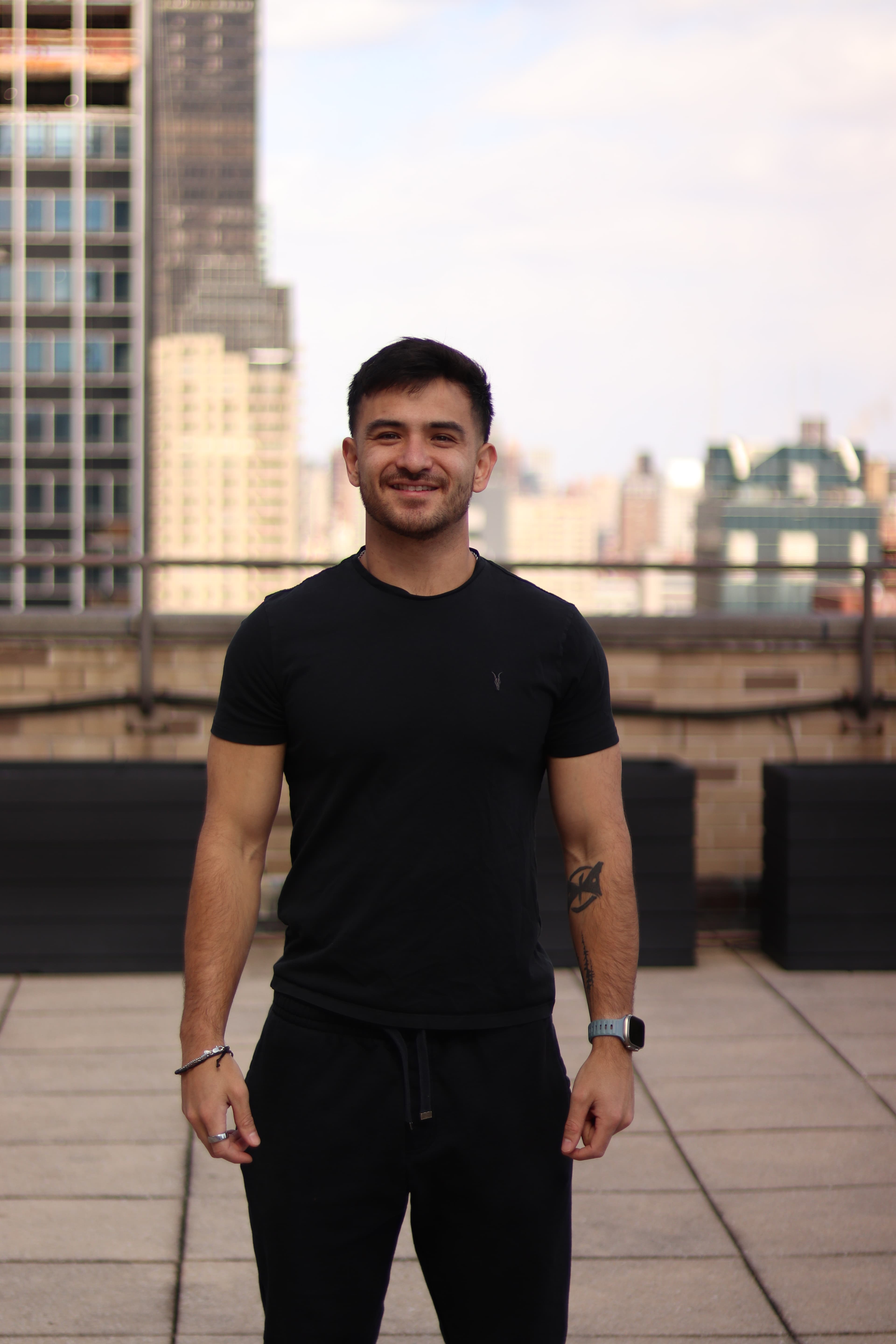 Alex Dea Jue smiling outdoors